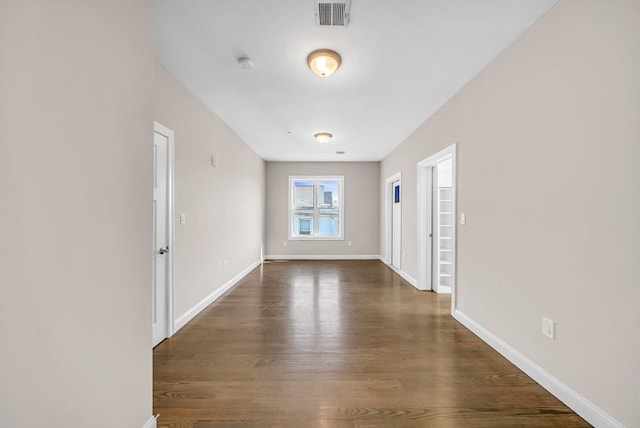 966 Hyde Park Ave Unit 301, Boston, MA 02136 - empty room with dark wood finished floors, baseboards, and a smoke detector