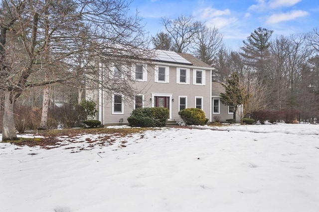 view of front of property with solar panels