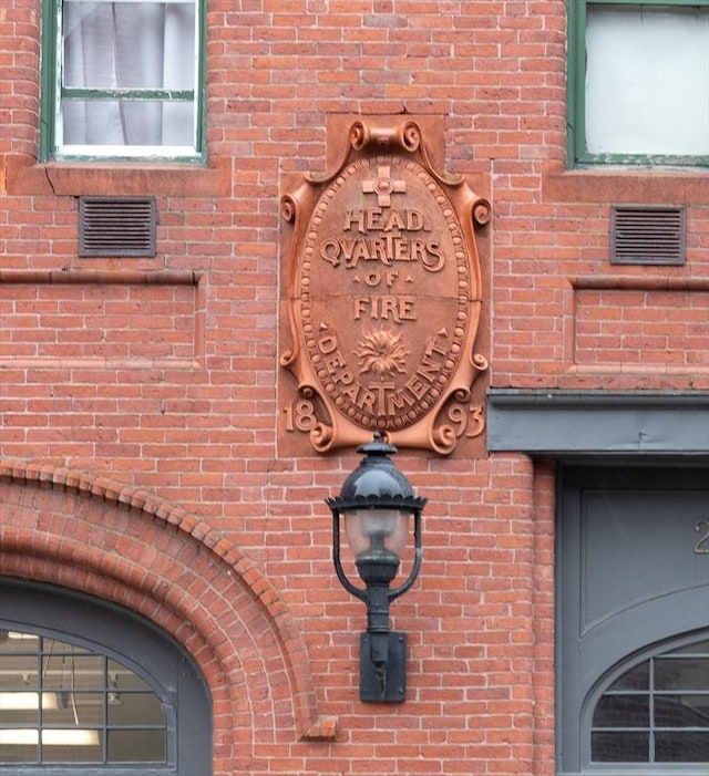 exterior details with brick siding and visible vents