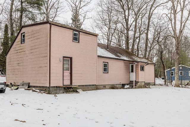 view of snow covered house