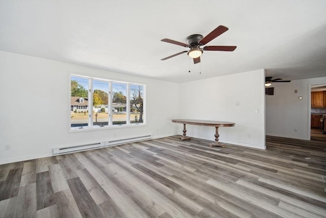 unfurnished living room featuring ceiling fan, a baseboard radiator, and light wood-type flooring