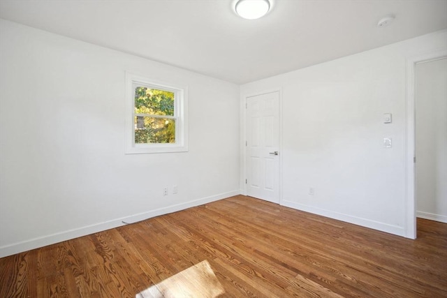 empty room featuring hardwood / wood-style flooring