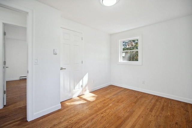 unfurnished bedroom featuring wood-type flooring