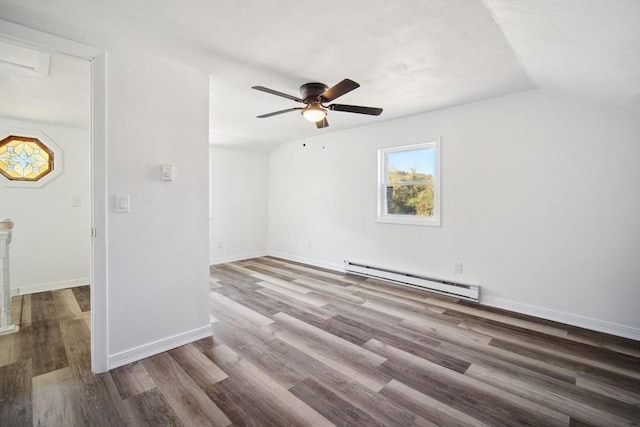 unfurnished room with ceiling fan, lofted ceiling, hardwood / wood-style floors, and a baseboard radiator