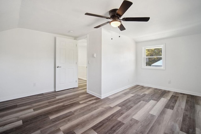 unfurnished room with ceiling fan, lofted ceiling, and hardwood / wood-style floors