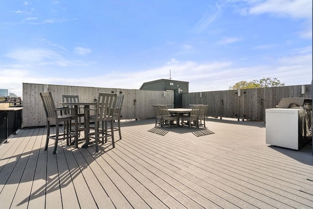 wooden deck with outdoor dining space