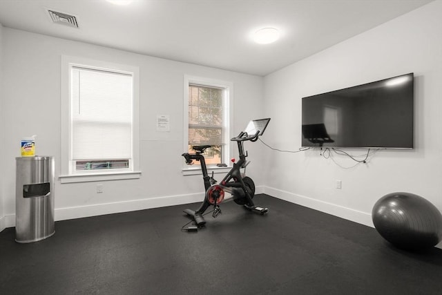 exercise room featuring baseboards and visible vents