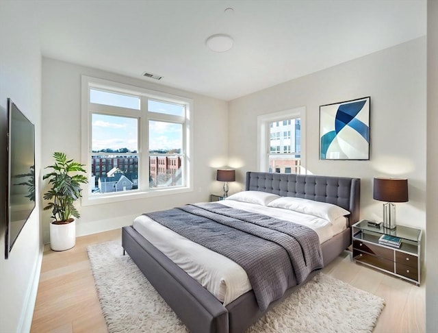 bedroom with light hardwood / wood-style floors