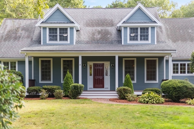 view of front of house featuring covered porch and a front yard