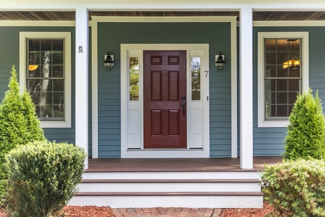 entrance to property featuring a porch