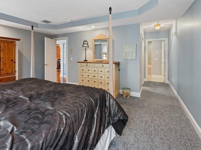 carpeted bedroom featuring visible vents and baseboards