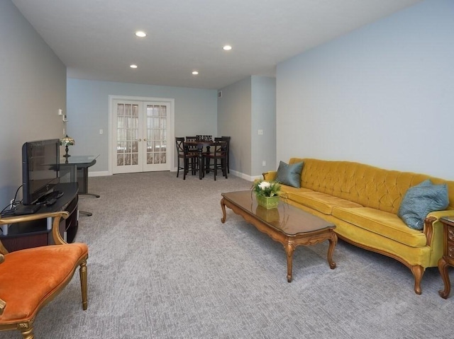 carpeted living area with baseboards, french doors, and recessed lighting