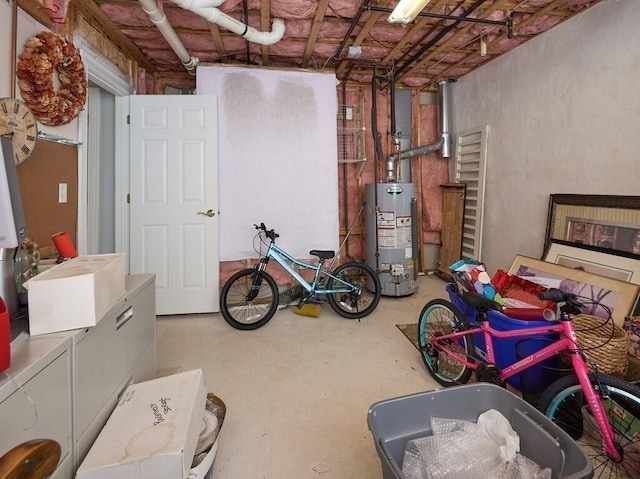 unfinished below grade area featuring water heater and independent washer and dryer