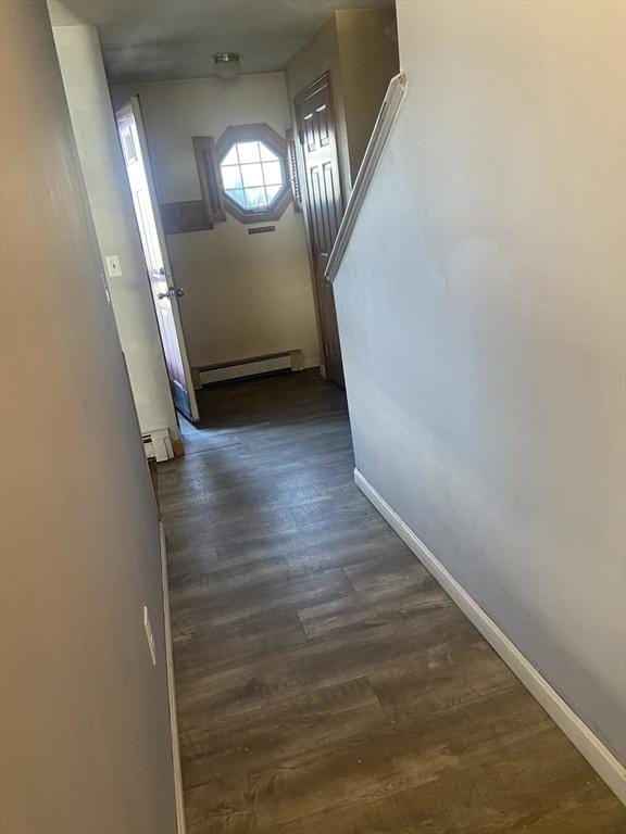 hall featuring dark hardwood / wood-style flooring and baseboard heating