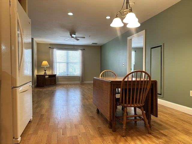 dining area with light wood-style flooring, baseboards, ceiling fan, and recessed lighting