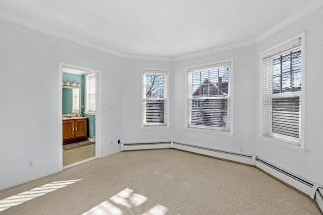 carpeted spare room featuring crown molding