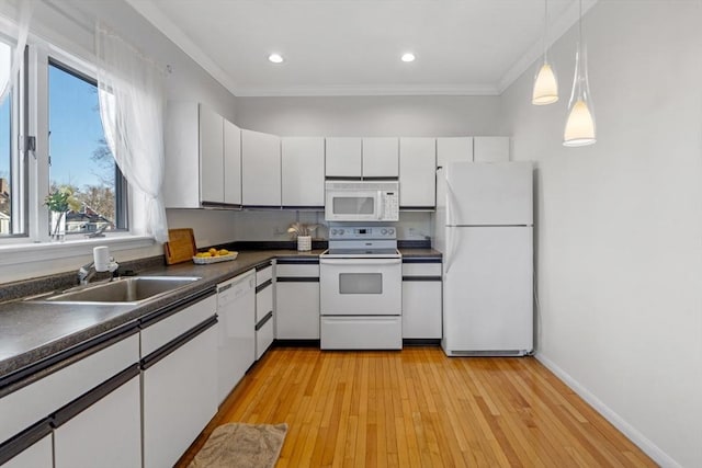 kitchen featuring white cabinetry, sink, white appliances, and ornamental molding