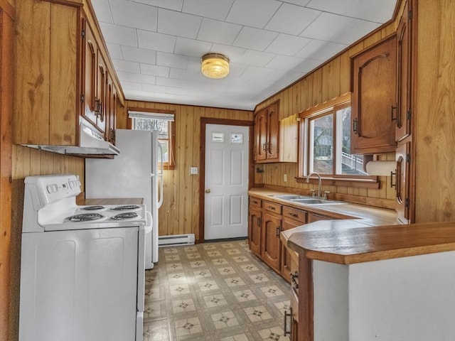 kitchen featuring brown cabinets, a sink, white range with electric cooktop, light floors, and a baseboard heating unit