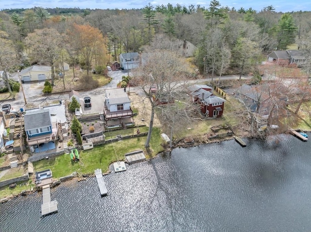 aerial view with a view of trees and a water view