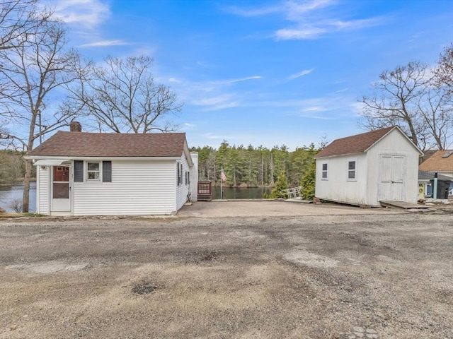 exterior space with a storage shed