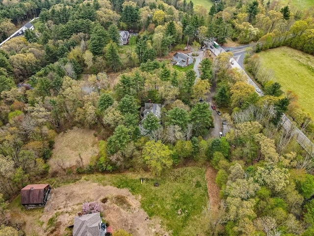 aerial view of property's location with a heavily wooded area