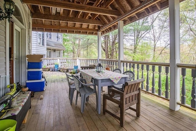 sunroom / solarium with outdoor dining space
