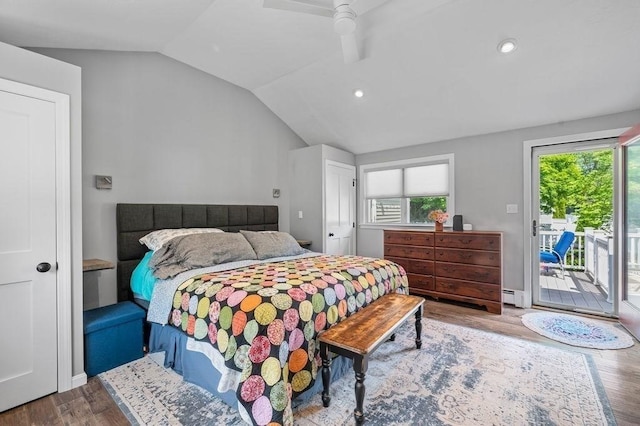 11 Beaver Park, Danvers, MA 01923 - bedroom with access to exterior, vaulted ceiling, a baseboard heating unit, multiple windows, and wood finished floors