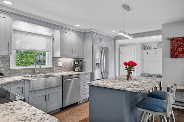 11 Beaver Park, Danvers, MA 01923 - kitchen with stainless steel appliances, gray cabinetry, a breakfast bar, decorative backsplash, and recessed lighting
