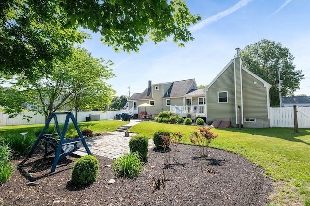 11 Beaver Park, Danvers, MA 01923 - fenced backyard featuring a patio area and a deck