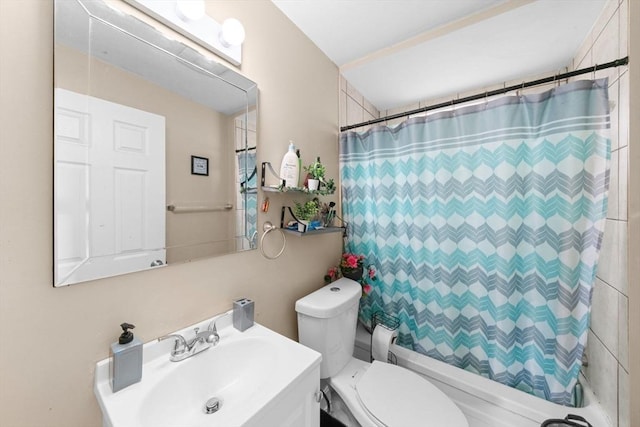 full bathroom featuring vanity, shower / bathtub combination with curtain, and toilet