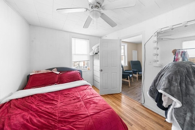 bedroom featuring ceiling fan and hardwood / wood-style floors