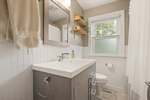 61 Fiske Ave, Waltham, MA 02453 - full bathroom with vanity and wainscoting
