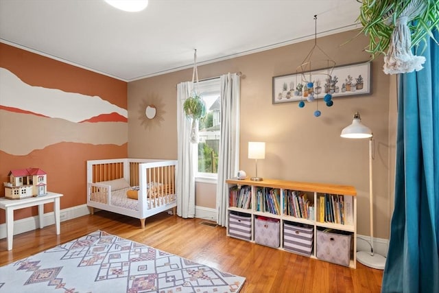61 Fiske Ave, Waltham, MA 02453 - bedroom featuring wood finished floors and ornamental molding