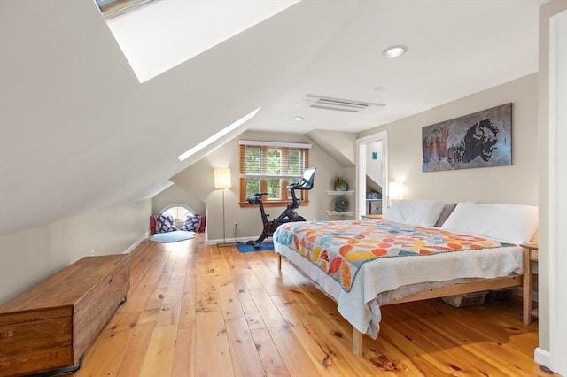61 Fiske Ave, Waltham, MA 02453 - bedroom featuring hardwood / wood-style flooring, vaulted ceiling, and a skylight