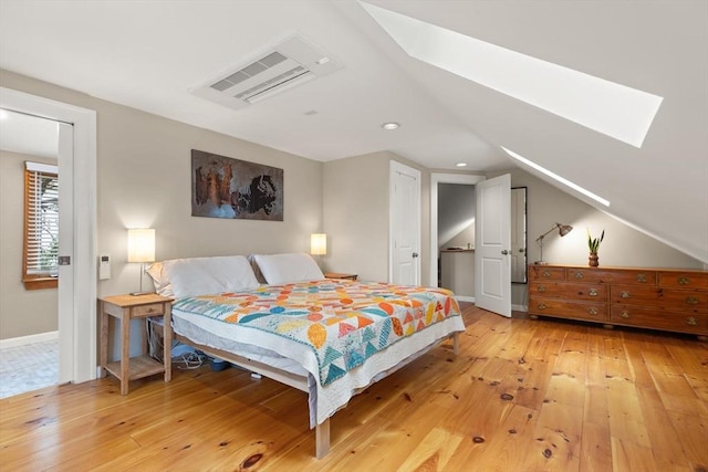 61 Fiske Ave, Waltham, MA 02453 - bedroom featuring a skylight, light wood finished floors, and vaulted ceiling