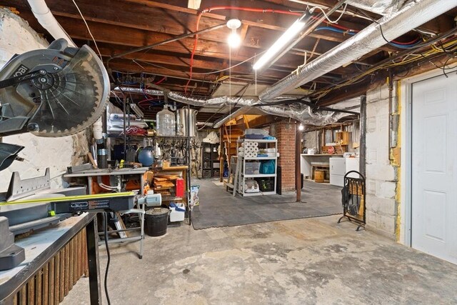 61 Fiske Ave, Waltham, MA 02453 - unfinished below grade area featuring washer / dryer and a workshop area