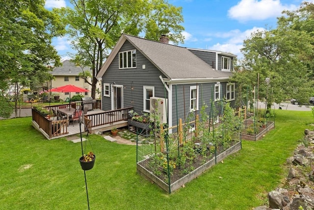 61 Fiske Ave, Waltham, MA 02453 - rear view of property featuring a garden, a chimney, a wooden deck, a yard, and a shingled roof