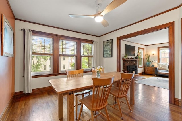 61 Fiske Ave, Waltham, MA 02453 - dining room with wood-type flooring, healthy amount of natural light, ceiling fan, and ornamental molding