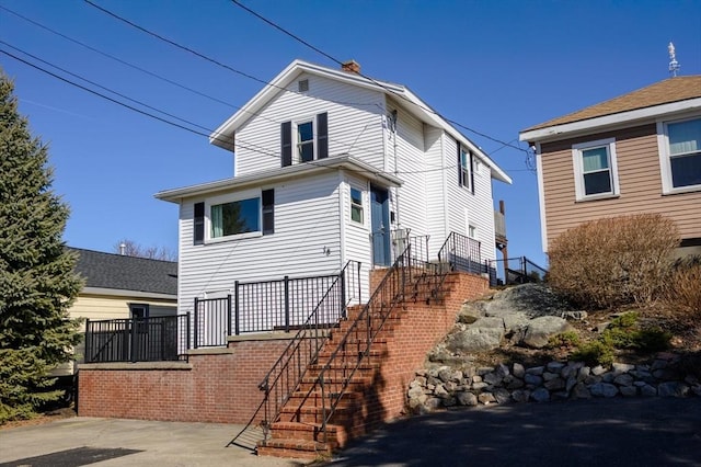 view of front of home featuring stairs