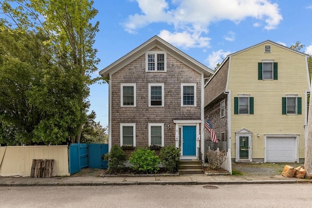 12 Callender Ave, Newport, RI 02840 - view of front of home featuring fence and a garage