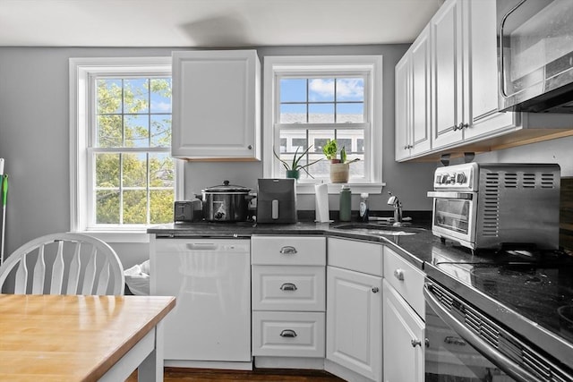 12 Callender Ave, Newport, RI 02840 - kitchen with white dishwasher, a sink, and plenty of natural light