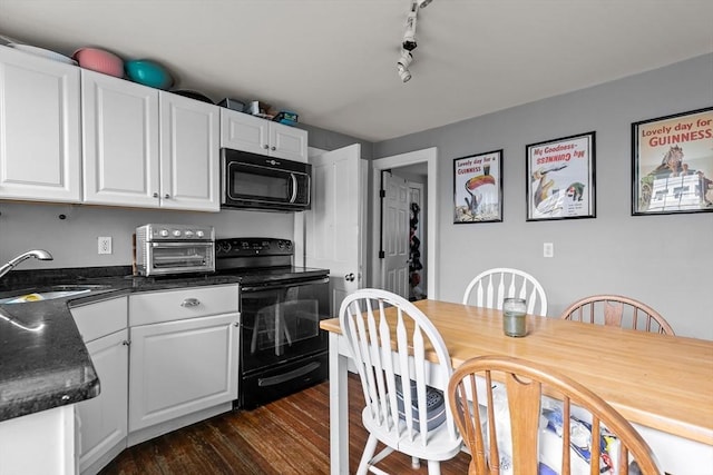 12 Callender Ave, Newport, RI 02840 - kitchen featuring black appliances, a sink, dark countertops, and white cabinets