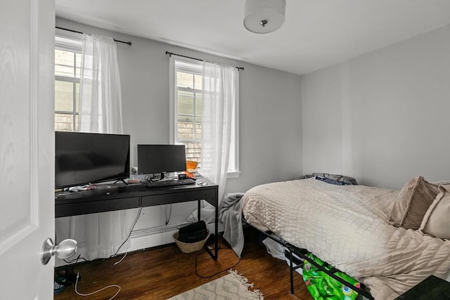 12 Callender Ave, Newport, RI 02840 - bedroom with wood finished floors, multiple windows, and a desk