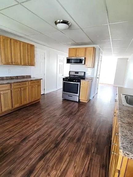 274 Harrison St, Fall River, MA 02723 - kitchen featuring stainless steel appliances and dark wood-style flooring