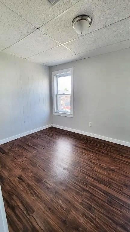 274 Harrison St, Fall River, MA 02723 - unfurnished room with dark wood-style flooring