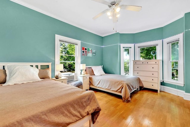 17 Teel St Unit 1, Arlington, MA 02474 - bedroom featuring light wood finished floors, crown molding, and ceiling fan