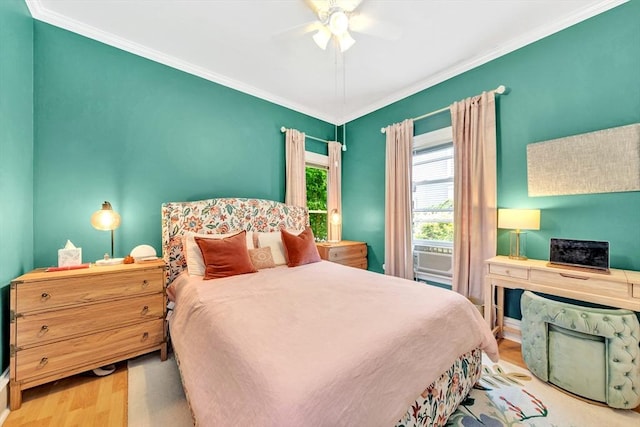 17 Teel St Unit 1, Arlington, MA 02474 - bedroom with wood finished floors, ornamental molding, and ceiling fan
