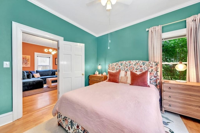 17 Teel St Unit 1, Arlington, MA 02474 - bedroom with crown molding, wood finished floors, and a ceiling fan