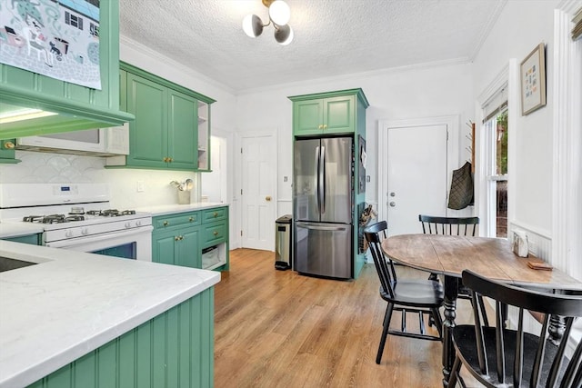17 Teel St Unit 1, Arlington, MA 02474 - kitchen featuring freestanding refrigerator, gas range gas stove, green cabinetry, light wood-style floors, and a textured ceiling