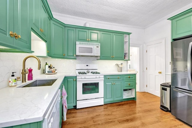 17 Teel St Unit 1, Arlington, MA 02474 - kitchen featuring white appliances, ornamental molding, a textured ceiling, light wood-type flooring, and backsplash